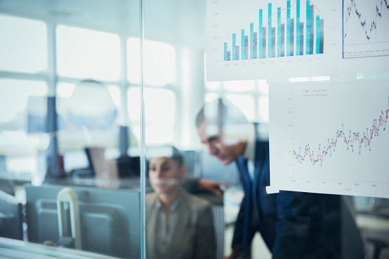 obscured view of office workers through the window