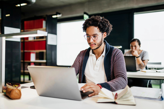 young businessperson working on laptop
